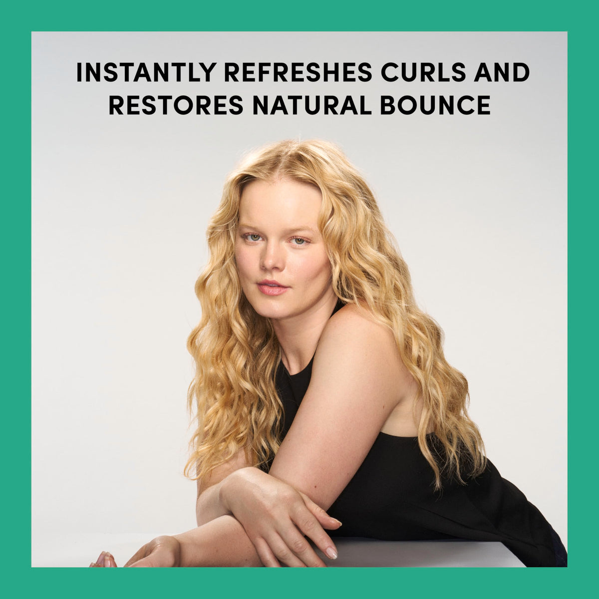 TRESemmé Bouncy Curls Leave-In Refresher 6.7 fl oz with curly hair close-up