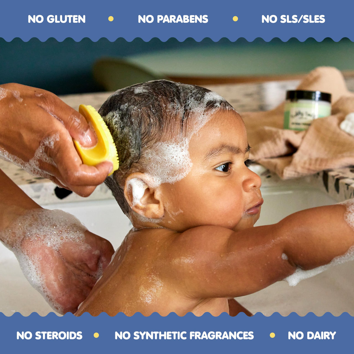 TUBBY TODD silicone brush in use on baby's head