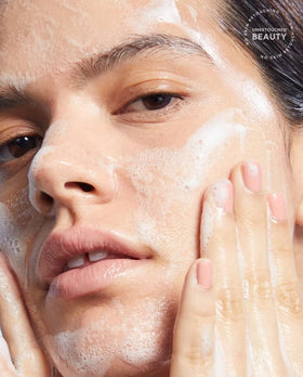 TULA cleanser in a bathroom setting with skincare products