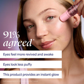 TULA Spresso Eye Balm with a background of skincare products