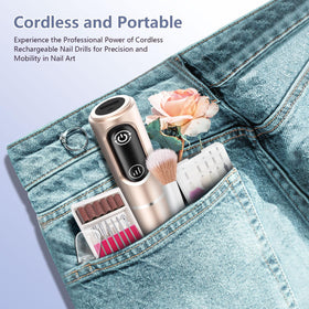 TUOBEO Cordless Nail Drill Kit in use on acrylic nails