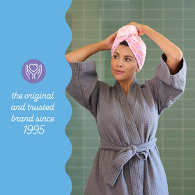 Turbie Twist Microfiber Hair Towel displayed with beauty products