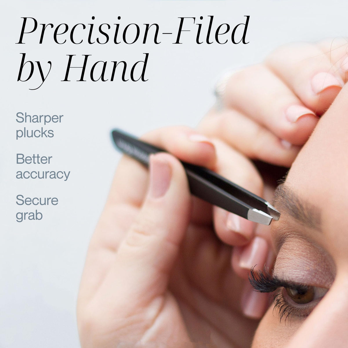 TWEEZER GURU tweezers held in hand for eyebrow grooming
