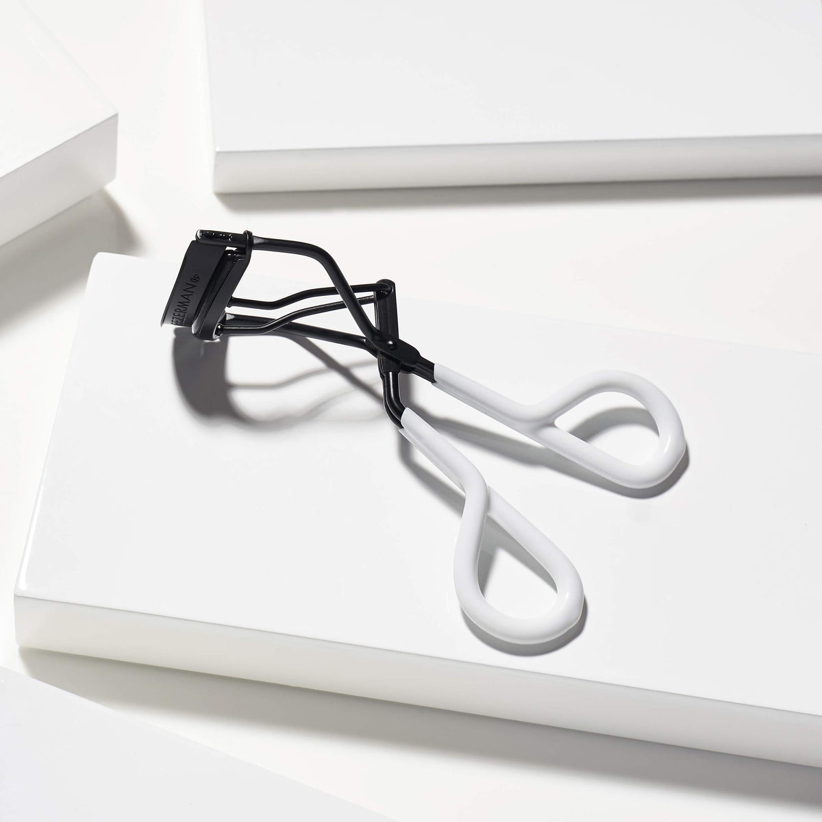 Tweezerman Great Grip Eyelash Curler side view showing ergonomic design