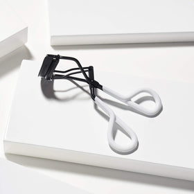 Tweezerman Great Grip Eyelash Curler side view showing ergonomic design