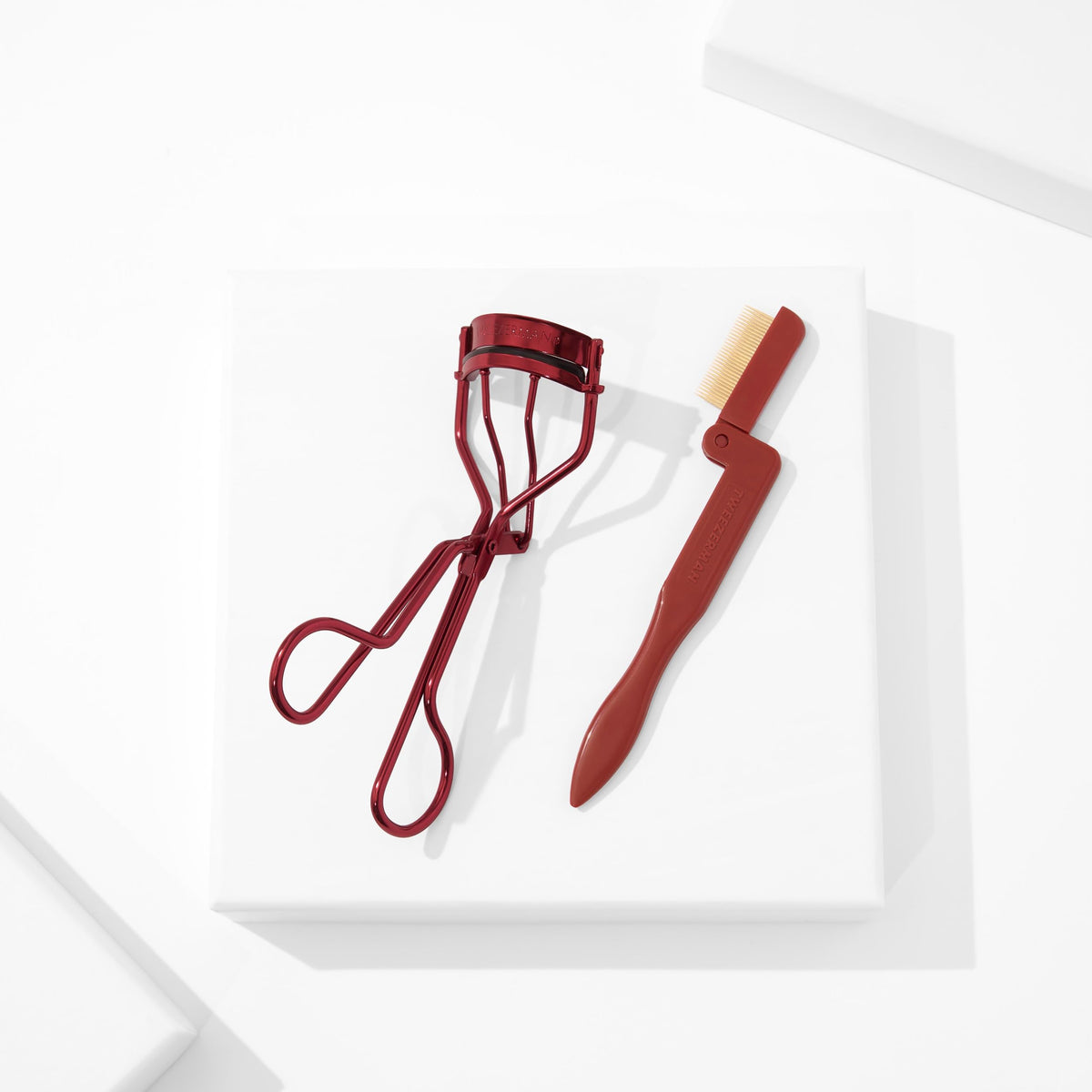 Tweezerman Lash Gift Set tools on a vanity