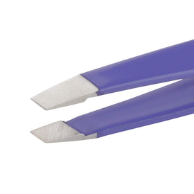 Tweezerman Mini Slant Tweezer displayed on a vanity