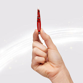 Tweezerman Mini Slant Tweezer on a vanity table
