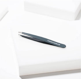 Tweezerman Slant Tweezer blue stone on vanity