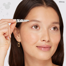 Tweezerman Slant Tweezer held in hand for brow shaping