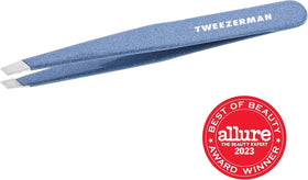 Tweezerman Slant Tweezer in hand demonstrating use