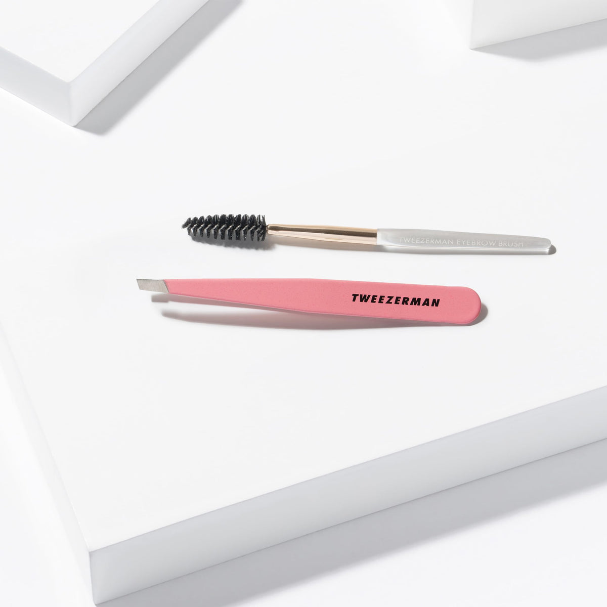 Tweezerman Slant Tweezer in hand for precise brow shaping
