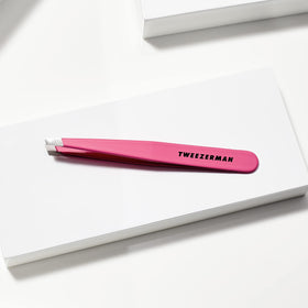 Tweezerman Slant Tweezer Neon Pink in hand