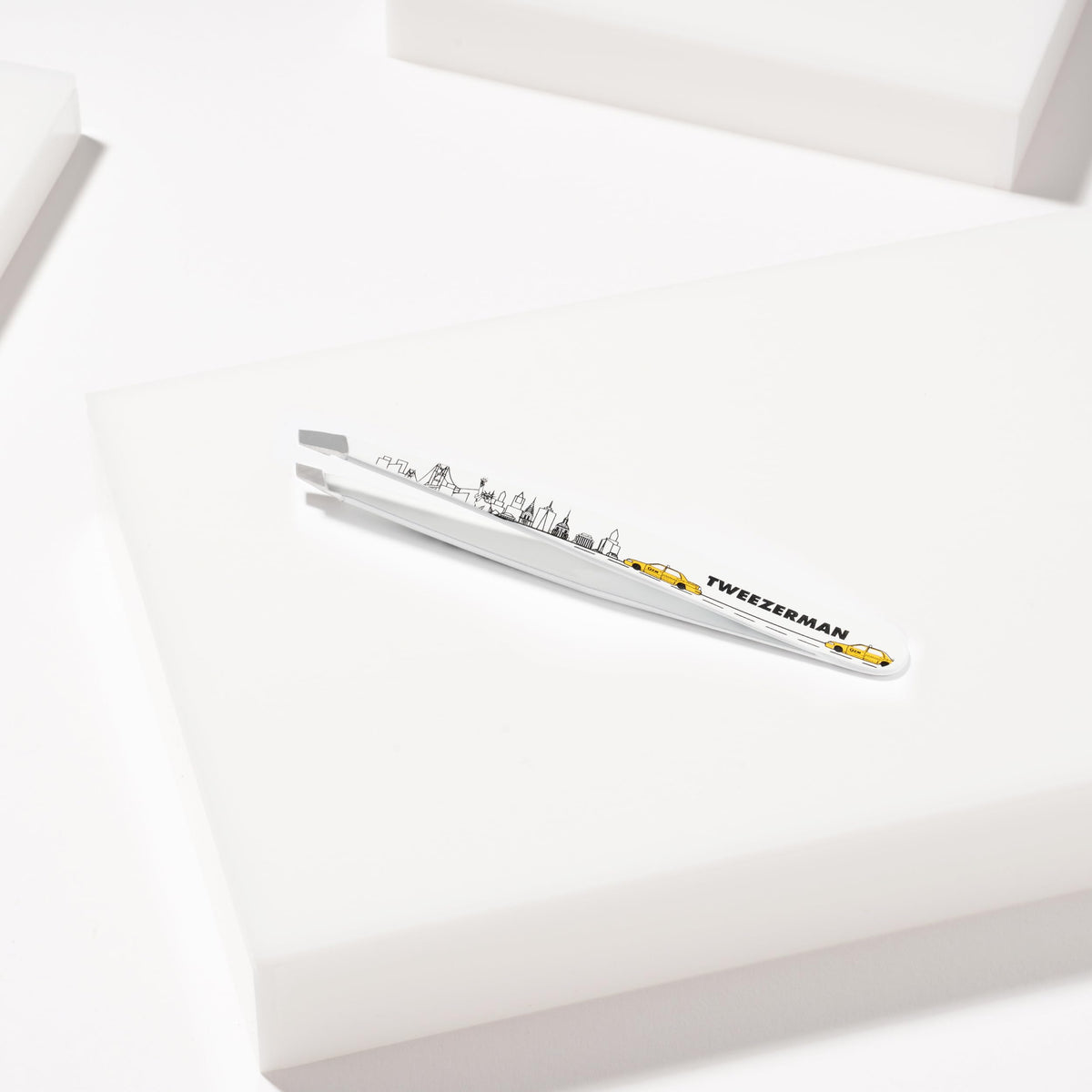 Tweezerman Slant Tweezer with a warm washcloth