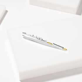 Tweezerman Slant Tweezer with a warm washcloth