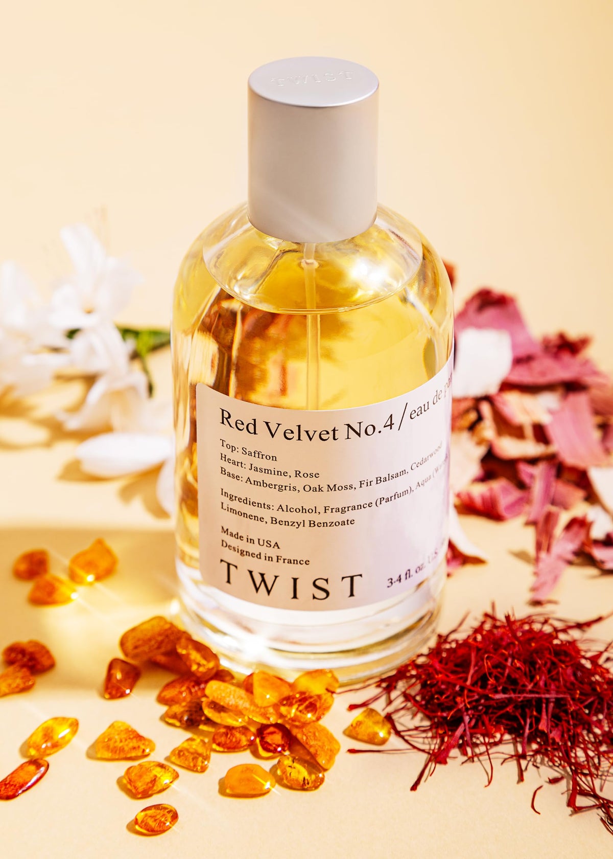 Twist Red Velvet No.4 Eau de Parfum bottle with floral background