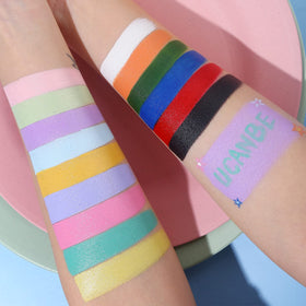UCANBE Face Body Paint palette in use at a festival