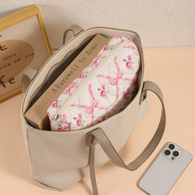 uekeboag Floral Cotton Makeup Bag in a travel suitcase