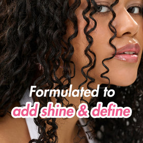 Umberto Giannini Curl Jelly 450g packaging with curls in background