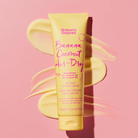 Umberto Giannini styling products on a bathroom shelf
