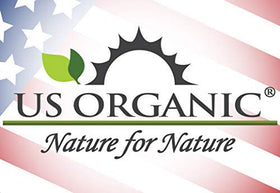 US Organic Myrrh and Frankincense Essential Oils on a wooden table