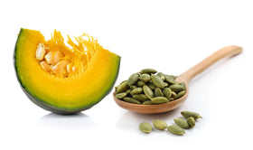 US Organic Pumpkin Seed Oil displayed with natural ingredients