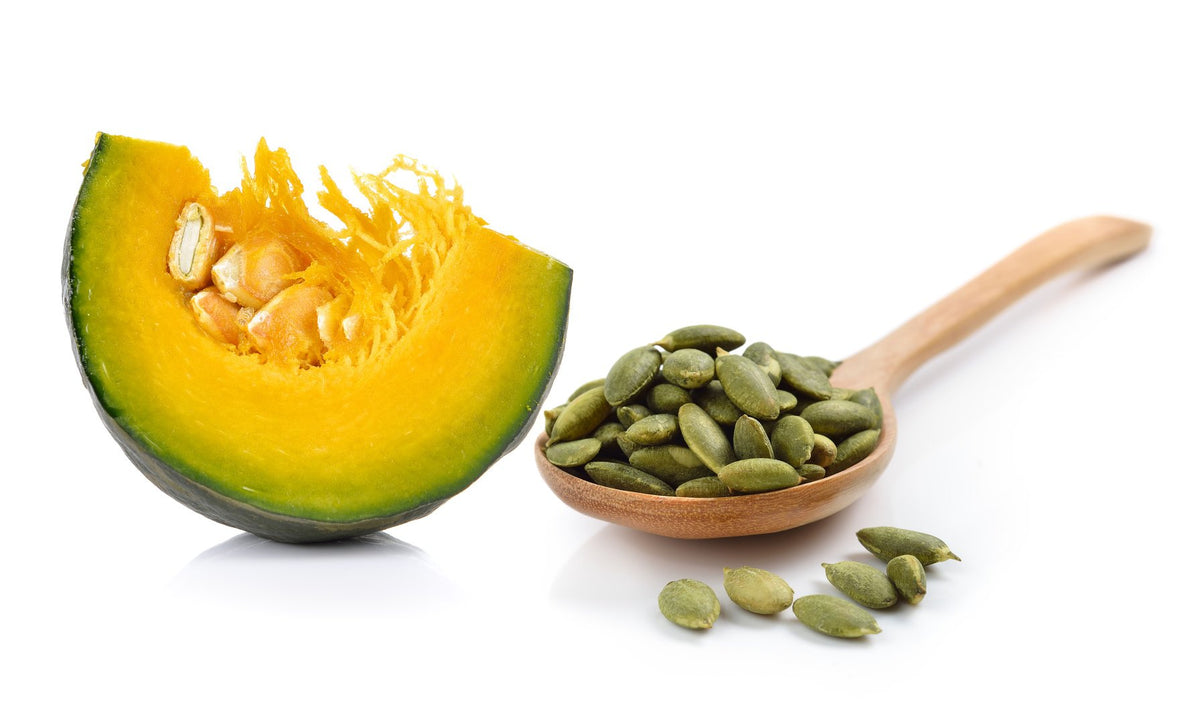 US Organic Pumpkin Seed Oil with a backdrop of natural ingredients