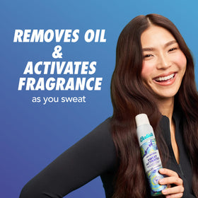 User applying Batiste Sweat Activated Dry Shampoo to hair