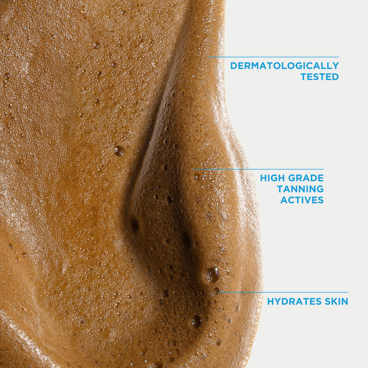 User applying Bondi Sands Self Tanning Foam with mitt