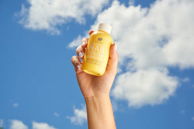 User applying ella+mila nail polish remover to nails