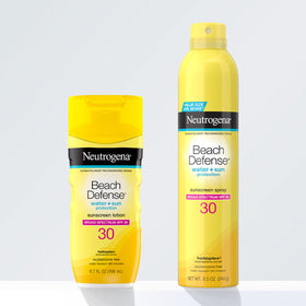 User applying Neutrogena Beach Defense Sunscreen Spray SPF 30 8.5 oz