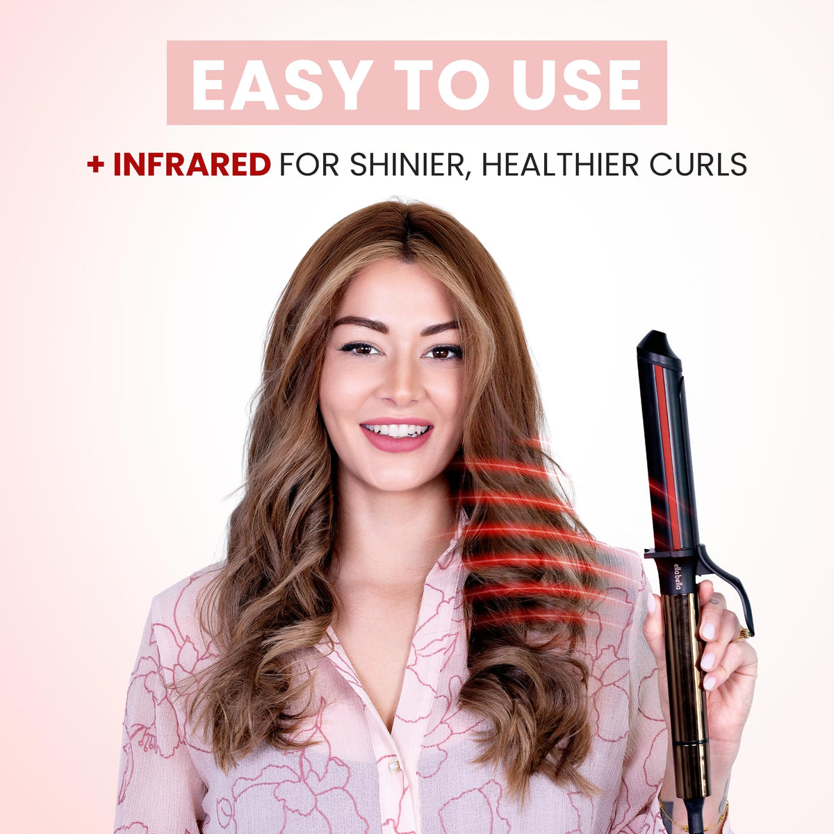 User styling hair with ELLA BELLA curling iron