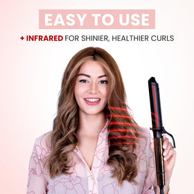 User styling hair with ELLA BELLA curling iron