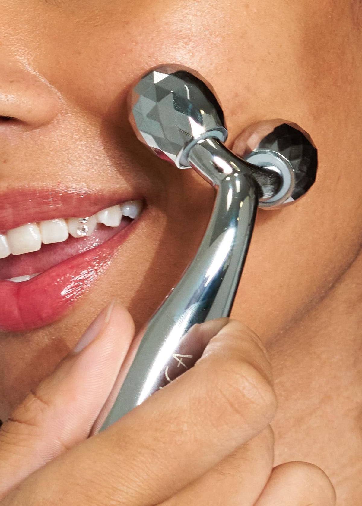 Using Pacifica face roller on cheekbones