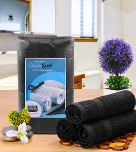 Utopia Towels black salon towels stacked neatly