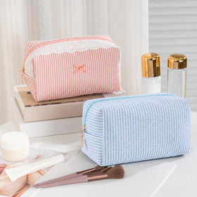 UUYUUY makeup bag being used in a travel setting