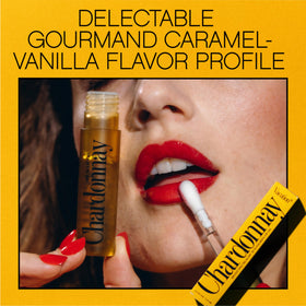 VACATION Lip Oil SPF 30 with a tropical background