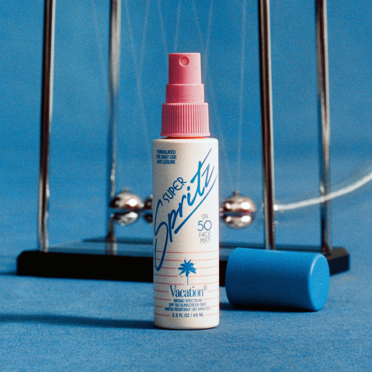 VACATION Mini Super Spritz SPF 50 Face Sunscreen Spray with other travel essentials