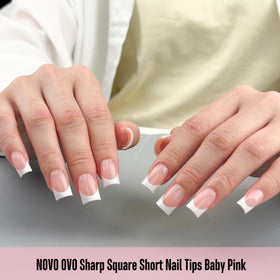 Various sizes of NOVO OVO Short Sharp Square French Tip Nail Tips displayed