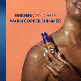 Vaseline Illuminate Me Shimmering Body Oil side view with shimmer effect