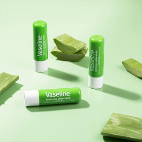 Vaseline Lip Balm on a table with skincare products
