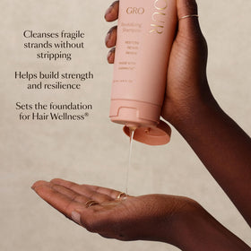VEGAMOUR GRO Revitalizing Shampoo 1.6 oz in a bathroom setting