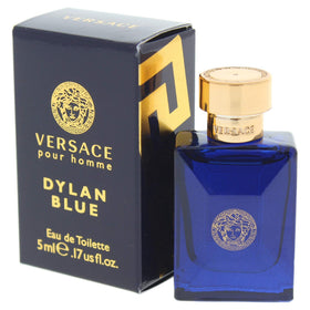 Versace Dylan Blue Mini Eau de Toilette splash on a wooden surface