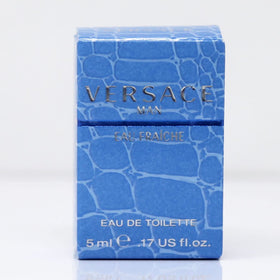 Versace Man Eau Fraiche Mini 5 mL on a table