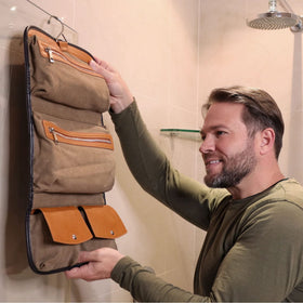 Vetelli Leather Toiletry Bag hanging hook attached to a bathroom door