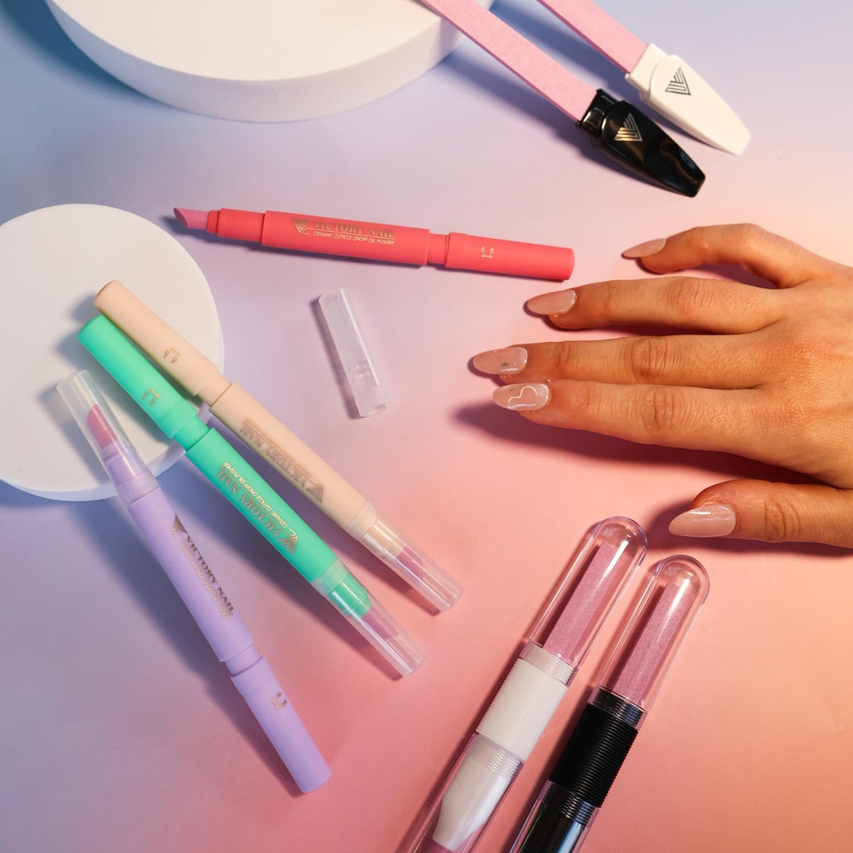 VICTORY NAIL Cuticle Oil Pen alongside nail care tools