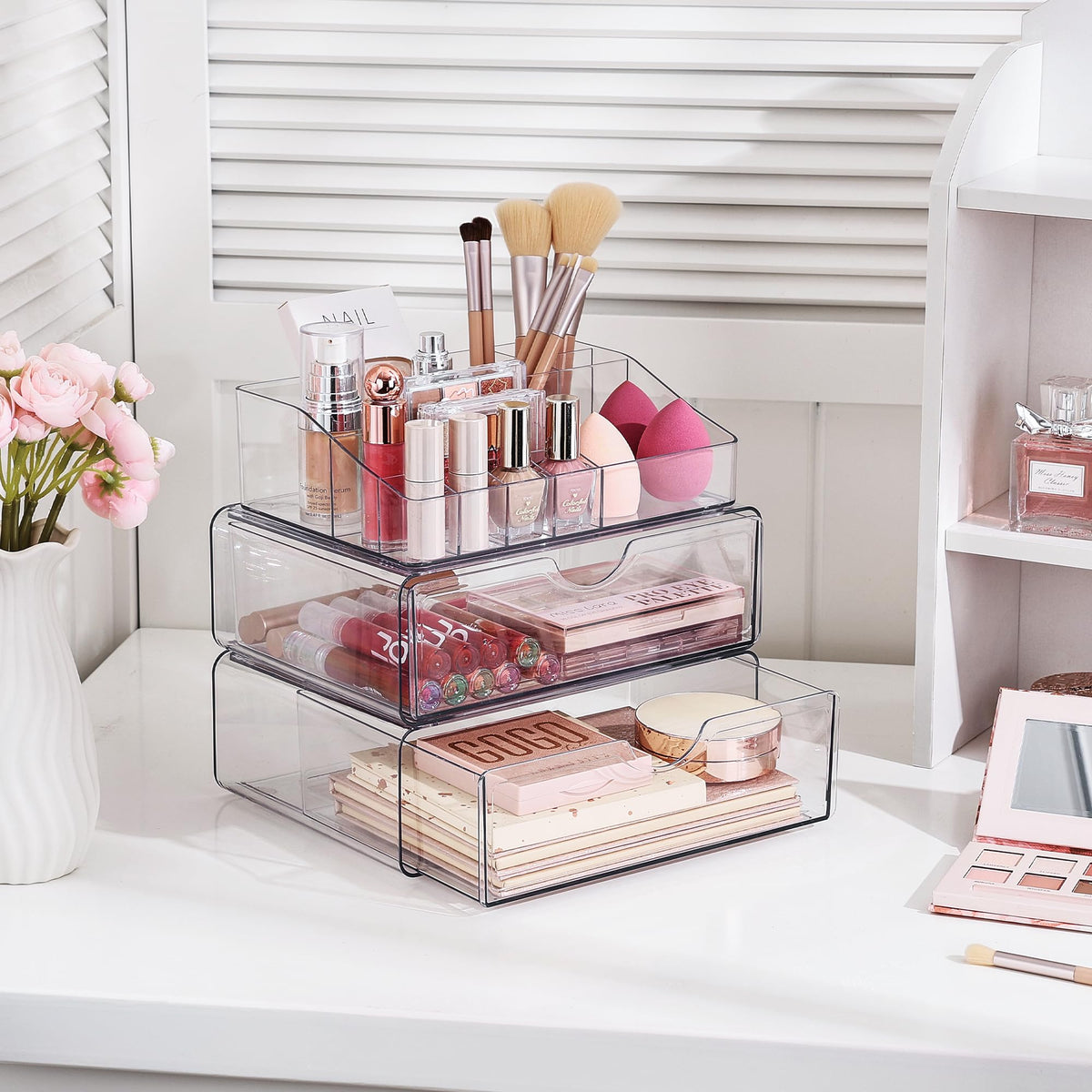 Vtopmart 3 Tier Clear Makeup Organizer on a bathroom vanity