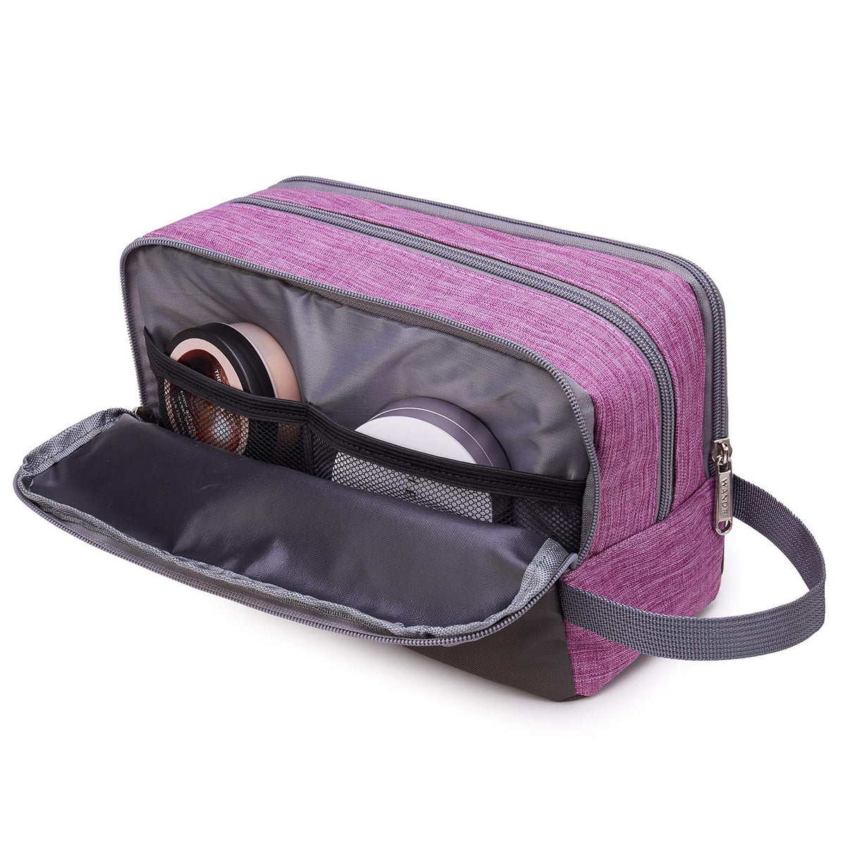 WANDF Travel Toiletry Bag compact size next to a travel suitcase