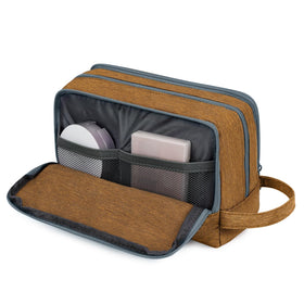 WANDF Travel Toiletry Bag compact size next to a travel suitcase