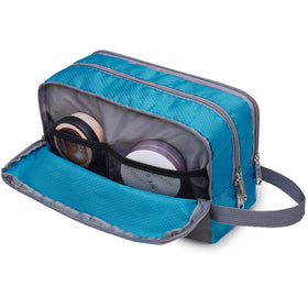 WANDF Travel Toiletry Bag in a travel setting with suitcase